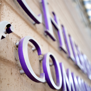 Close up photo of raised purple building signage