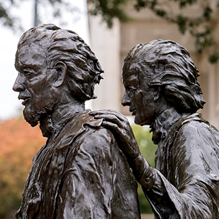 A bronze statue of TCU founders Addison and Randolph Clark