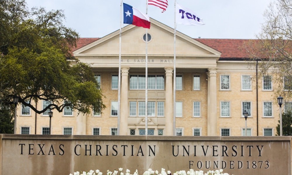 Sadler Hall with main TCU sign and flags